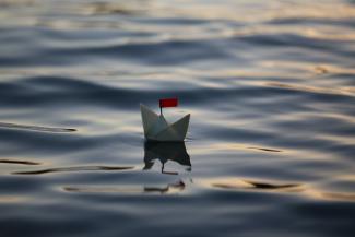 A paper boat floating in water